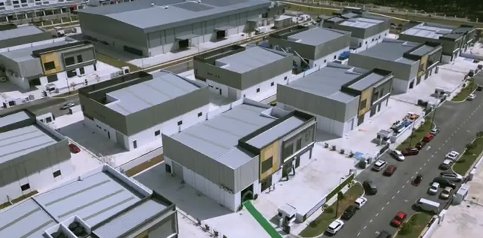 Aerial view of a poultry waste infrastructure site spanning multiple farm buildings